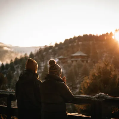 Silhouettes Praying at Winter Sunset Overlook