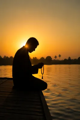 Sunset Prayer Silhouette Beside Calm Water