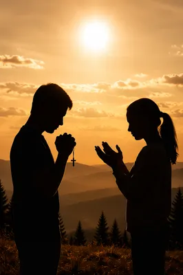 Silhouettes Praying at Sunset Among Evergreens