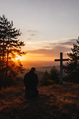 Silhouetted Prayer on Evergreen Hill at Sunset