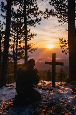 Silhouette Praying by Evergreen Sunset Cross
