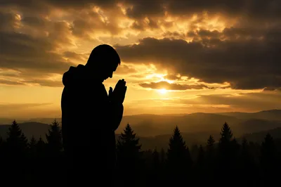 Silhouette Prayer at Golden Evergreen Sunset