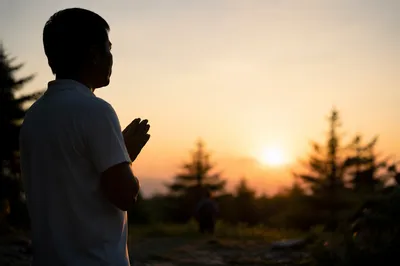 Praying Silhouette by Evergreen Sunset