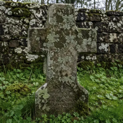 Weathered Stone Cross in Historic Cemetery