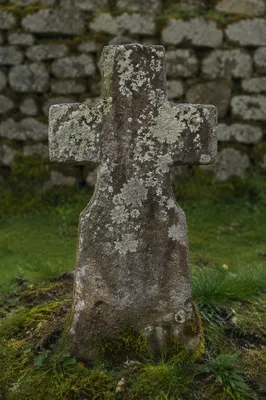 Weathered Stone Cross in Historic Cemetery