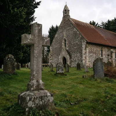Weathered Stone Cross in Rural Cemetery
