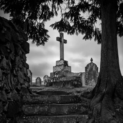 Weathered Stone Cross in Old Cemetery
