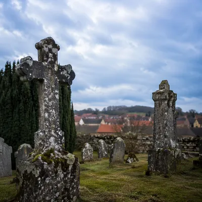 Weathered Stone Cross in Rural Cemetery