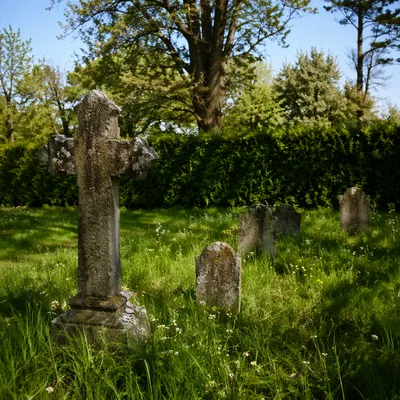 Weathered Stone Cross in Evergreen Cemetery