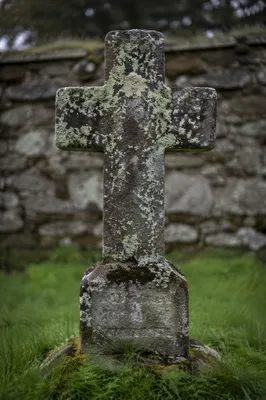 Weathered Stone Cross in Historic Cemetery