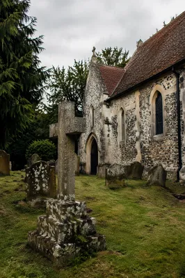Weathered Stone Cross in Rural Cemetery