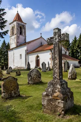 Weathered Stone Cross by Historic Church