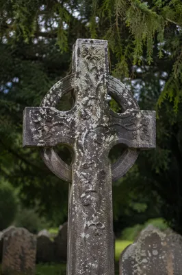 Weathered Stone Cross in Evergreen Cemetery