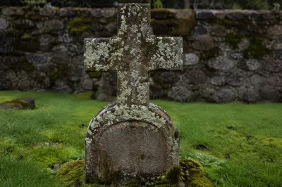 Weathered Stone Cross in Historic Cemetery