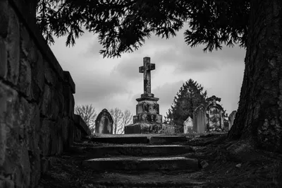 Weathered Stone Cross in Evergreen Cemetery