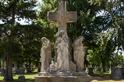 Weathered Stone Cross in Evergreen Cemetery