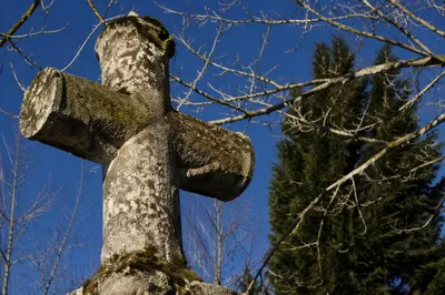 Weathered Stone Cross in Evergreen Cemetery