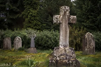Weathered Stone Cross in Evergreen Cemetery