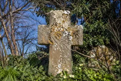 Weathered Stone Cross in Evergreen Cemetery