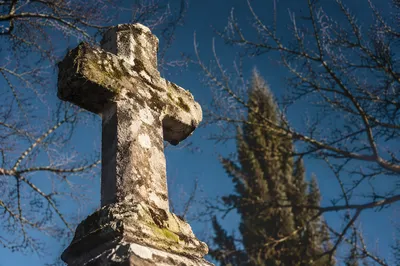 Weathered Stone Cross in Evergreen Cemetery
