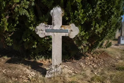 Weathered Stone Cross in Evergreen Cemetery