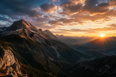 Golden Sunrise Over Evergreen Mountain Range
