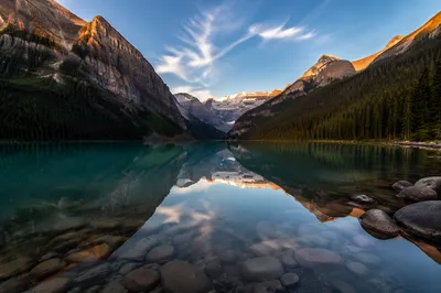 Golden Sunrise Over Evergreen Alpine Lake