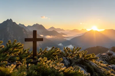 Wooden Cross at Golden Alpine Sunrise