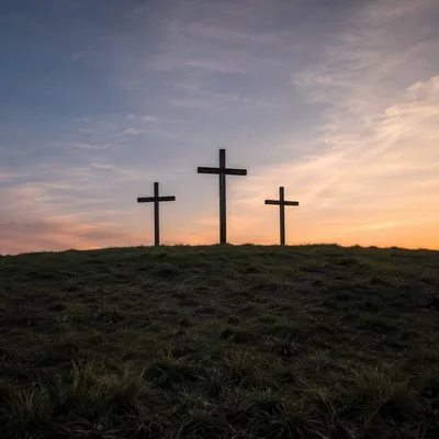Three Wooden Crosses at Peaceful Sunset