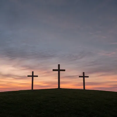 Three Wooden Crosses at Twilight Sunset