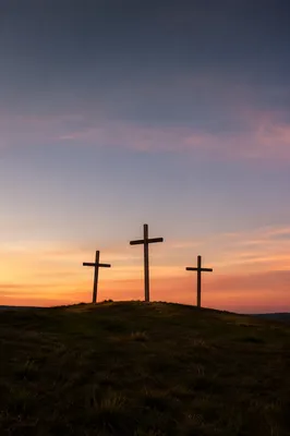 Three Crosses on a Sunset Hill