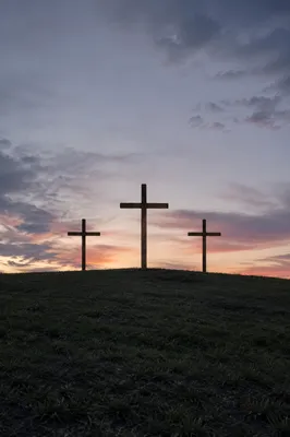 Three Crosses on a Sunset Hill
