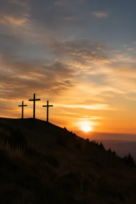 Three Crosses on Hill at Sunset