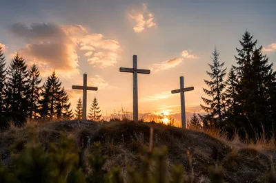 Three Wooden Crosses at Evergreen Sunset