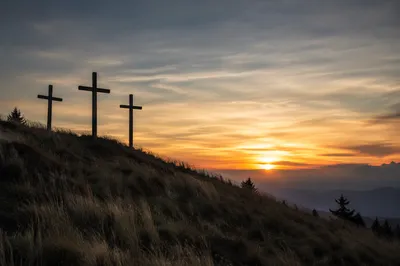 Three Crosses at Sunset on Hill