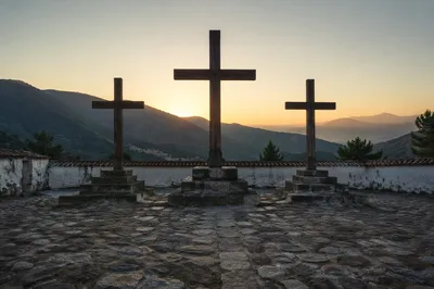 Three Crosses on Hill at Sunset