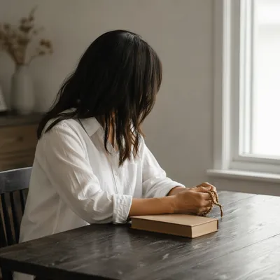 Woman Reading Bible Beside Bright Window