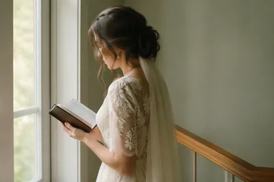 Serene Bride Reading Bible by Window