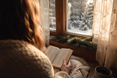 Woman Reading Bible by Frosted Window
