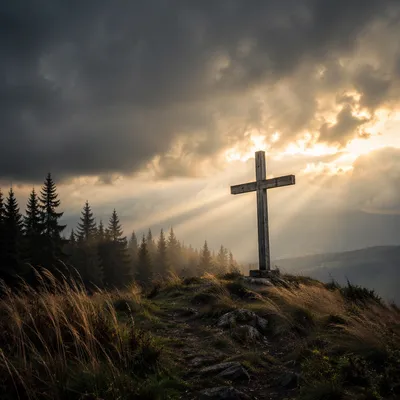 Weathered Cross on Evergreen Hill at Sunset