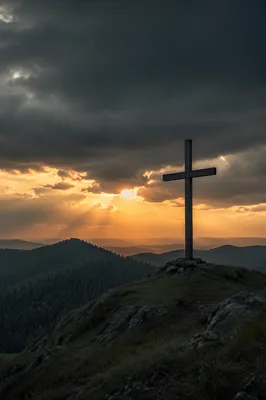 Wooden Cross on Evergreen Hill at Sunset