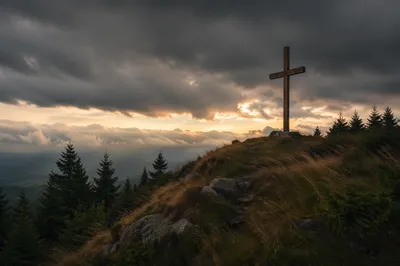Wooden Cross on Stormy Evergreen Hilltop