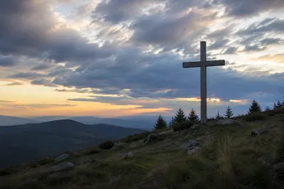 Weathered Cross on Evergreen Hilltop at Dusk