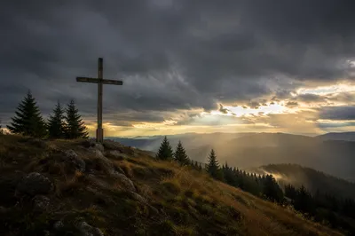 Weathered Wooden Cross Beneath Dramatic Sky