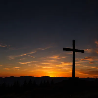 Wooden Cross Silhouette at Evergreen Sunrise