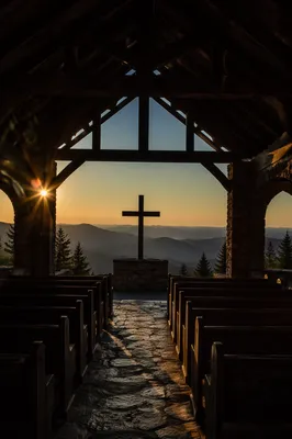Wooden Cross Sunrise in Mountain Chapel