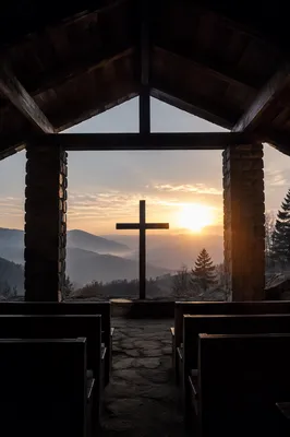 Wooden Cross Silhouette at Mountain Sunrise