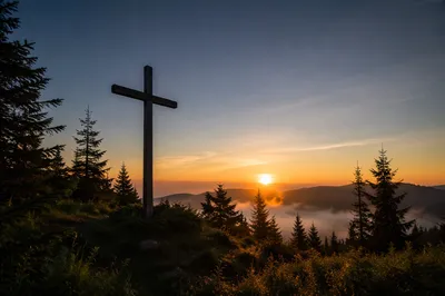 Wooden Cross Silhouette at Evergreen Sunrise