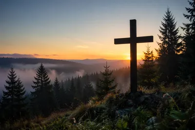 Wooden Cross Silhouette at Evergreen Sunrise