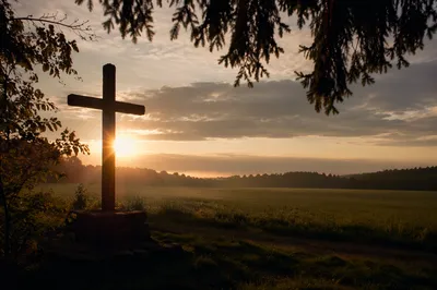 Wooden Cross Silhouette at Rural Sunrise
